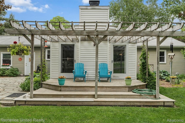 3875 Zimmer Rd, Williamston, MI 48895 - rear view of property with a deck, a pergola, and a lawn