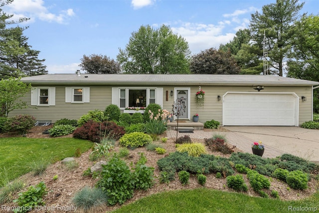 3875 Zimmer Rd, Williamston, MI 48895 - ranch-style home with an attached garage, concrete driveway, and a front lawn