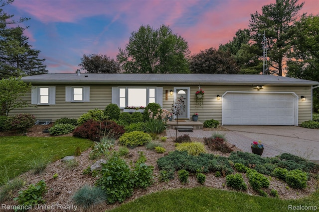 3875 Zimmer Rd, Williamston, MI 48895 - ranch-style home with an attached garage, driveway, and a front lawn