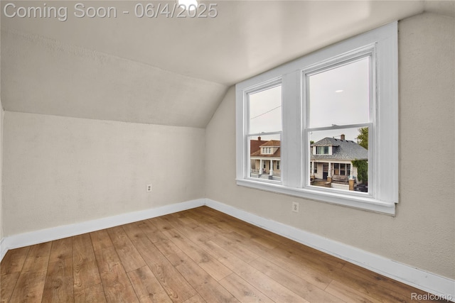 3851 Fredro St, Hamtramck, MI 48212 - additional living space featuring vaulted ceiling, baseboards, and wood-type flooring