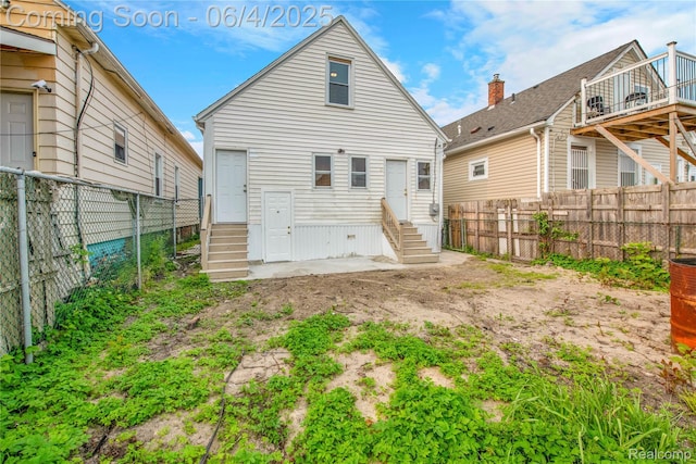 3851 Fredro St, Hamtramck, MI 48212 - back of house with entry steps and a fenced backyard