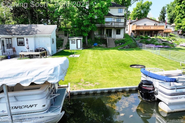 11265 N Shore Dr, Whitmore Lake, MI 48189 - view of yard with a dock and a deck with water view