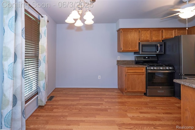 35485 Stillmeadow Ln, Clinton Township, MI 48035 - kitchen featuring stainless steel appliances, a ceiling fan, light wood-style floors, a chandelier, and pendant lighting