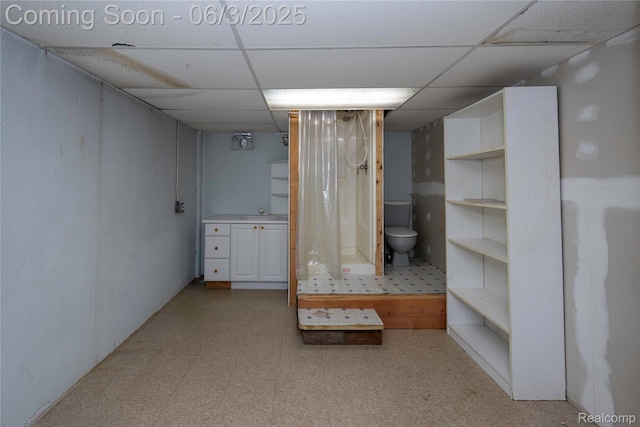 35485 Stillmeadow Ln, Clinton Township, MI 48035 - finished below grade area with a paneled ceiling, light floors, and a sink