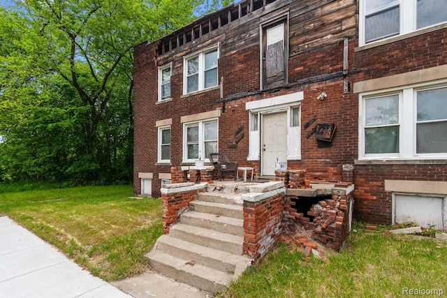 3804 Hudson St, Detroit, MI 48208 - view of front of property with brick siding and a front yard