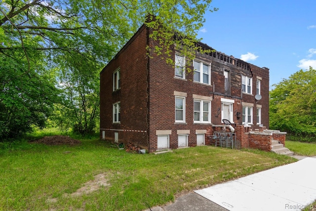 3804 Hudson St, Detroit, MI 48208 - view of front of house with brick siding and a front yard