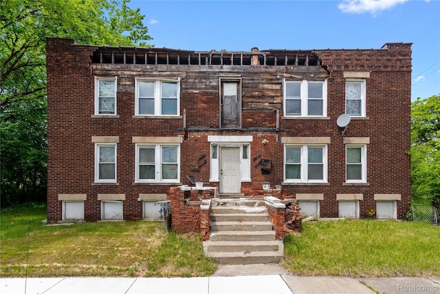 3804 Hudson St, Detroit, MI 48208 - view of front of property with brick siding and a front yard