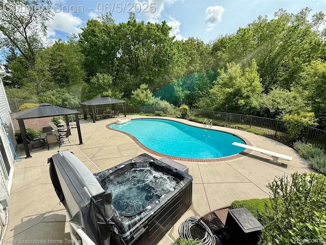 13999 French Ln, Davisburg, MI 48350 - view of swimming pool with a gazebo, a patio area, a hot tub, and a diving board