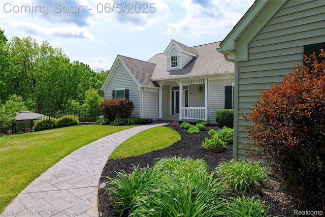 13999 French Ln, Davisburg, MI 48350 - view of front of house with a shingled roof and covered porch