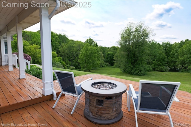13999 French Ln, Davisburg, MI 48350 - wooden deck featuring an outdoor fire pit and a yard
