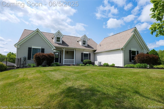 13999 French Ln, Davisburg, MI 48350 - cape cod home with a porch and a shingled roof
