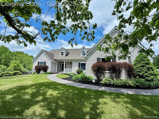 13999 French Ln, Davisburg, MI 48350 - cape cod house with a shingled roof and covered porch