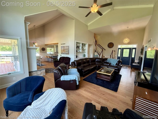 13999 French Ln, Davisburg, MI 48350 - living area featuring high vaulted ceiling, stairs, wood finished floors, beam ceiling, and a ceiling fan