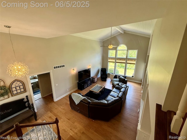 13999 French Ln, Davisburg, MI 48350 - living area featuring a chandelier, baseboards, wood finished floors, beamed ceiling, and high vaulted ceiling