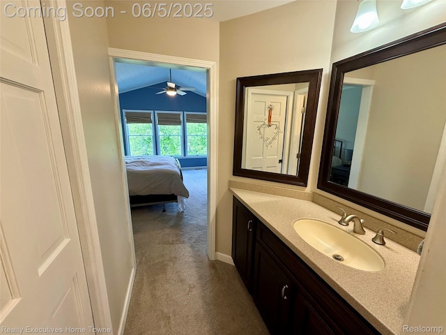 13999 French Ln, Davisburg, MI 48350 - bathroom with vaulted ceiling, vanity, ensuite bathroom, a ceiling fan, and baseboards