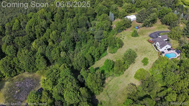 13999 French Ln, Davisburg, MI 48350 - view of property location with a pool and a heavily wooded area
