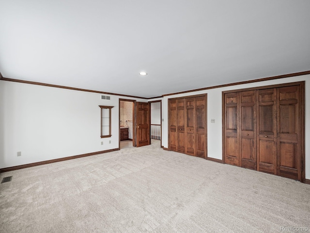 4932 Susans Way, Bloomfield Hills, MI 48302 - unfurnished bedroom with crown molding, baseboards, carpet, two closets, and recessed lighting