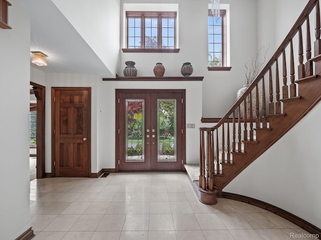 4932 Susans Way, Bloomfield Hills, MI 48302 - foyer entrance featuring a high ceiling, french doors, stairway, and healthy amount of natural light