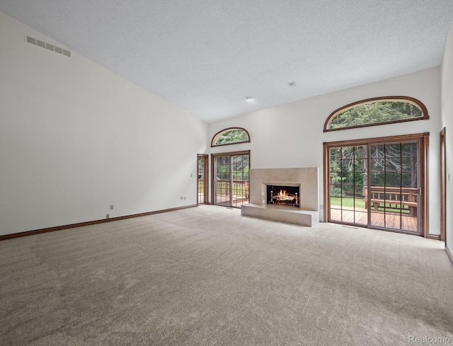 4932 Susans Way, Bloomfield Hills, MI 48302 - unfurnished living room featuring carpet flooring, a fireplace, baseboards, and a towering ceiling