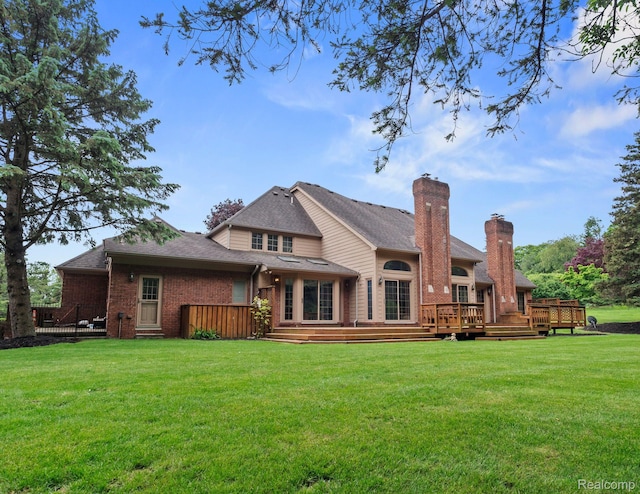 4932 Susans Way, Bloomfield Hills, MI 48302 - rear view of property featuring brick siding, a deck, and a lawn
