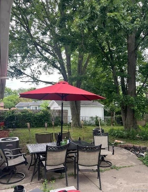 41541 Mcbride Ave, Van Buren, MI 48111 - view of patio / terrace with outdoor dining space and central AC