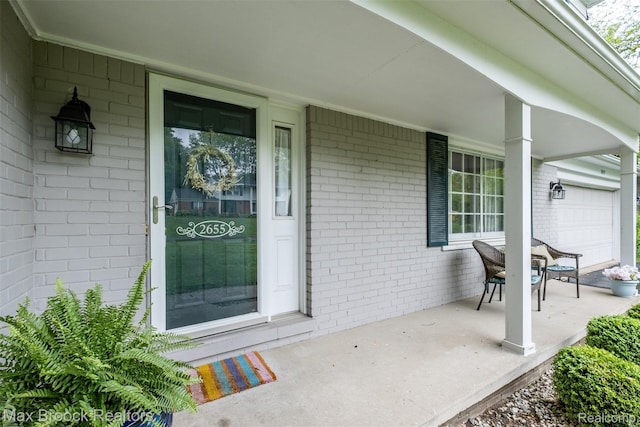 2655 Aspen Ln, Bloomfield Hills, MI 48302 - property entrance featuring covered porch and brick siding