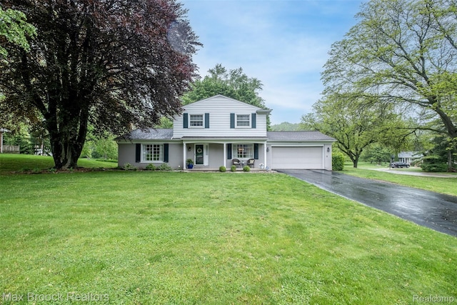 2655 Aspen Ln, Bloomfield Hills, MI 48302 - traditional home with asphalt driveway, an attached garage, covered porch, and a front yard