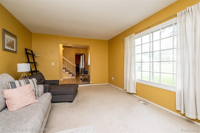 2655 Aspen Ln, Bloomfield Hills, MI 48302 - carpeted living room featuring plenty of natural light, stairs, and baseboards