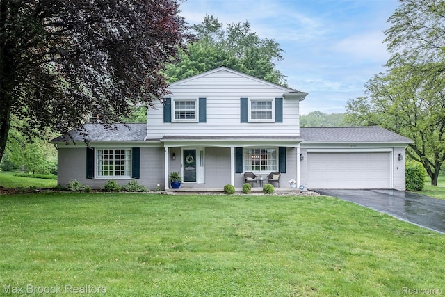 2655 Aspen Ln, Bloomfield Hills, MI 48302 - traditional home with asphalt driveway, a garage, covered porch, a shingled roof, and a front lawn