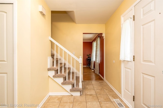 2655 Aspen Ln, Bloomfield Hills, MI 48302 - foyer with light tile patterned floors, stairs, and baseboards