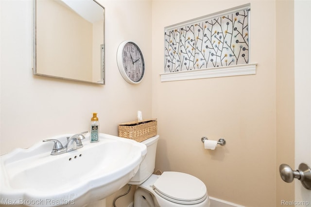 2655 Aspen Ln, Bloomfield Hills, MI 48302 - half bath with a sink, toilet, and baseboards