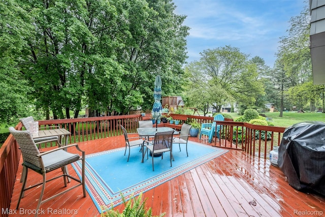 2655 Aspen Ln, Bloomfield Hills, MI 48302 - deck with outdoor dining space and view of wooded area