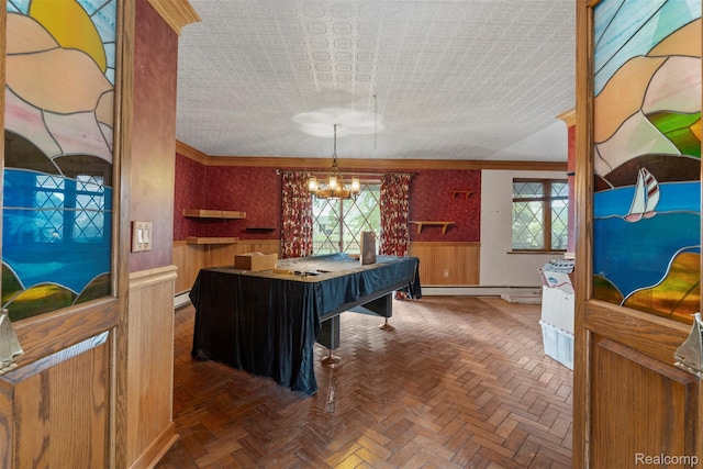 49748 Regatta St, Chesterfield, MI 48047 - recreation room featuring wainscoting, plenty of natural light, a chandelier, baseboard heating, and crown molding