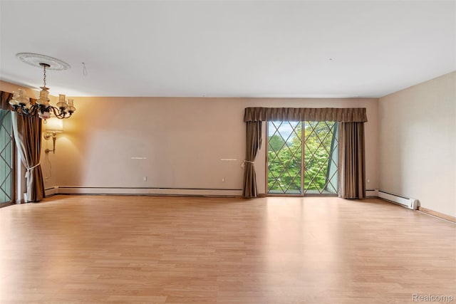 49748 Regatta St, Chesterfield, MI 48047 - empty room with light wood-type flooring and a baseboard radiator