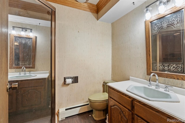 49748 Regatta St, Chesterfield, MI 48047 - bathroom with a baseboard heating unit, vanity, toilet, and wood finished floors