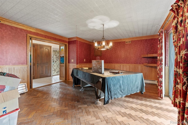 49748 Regatta St, Chesterfield, MI 48047 - dining room featuring a wainscoted wall, baseboard heating, a chandelier, crown molding, and wood walls