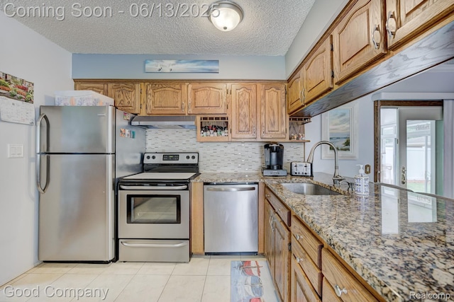 1378 Surrey Hts, Westland, MI 48186 - kitchen with stainless steel appliances, extractor fan, light stone counters, decorative backsplash, and light tile patterned floors