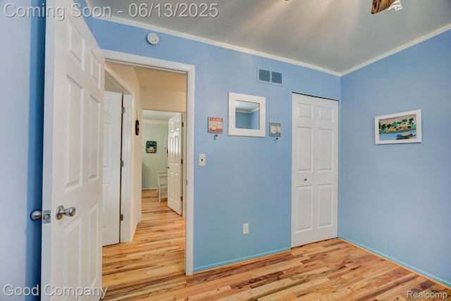 1378 Surrey Hts, Westland, MI 48186 - unfurnished bedroom featuring light wood-style flooring, ornamental molding, and a closet
