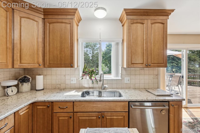 4311 Maplewood Meadows Ave, Grand Blanc, MI 48439 - kitchen featuring a sink, stainless steel dishwasher, light stone counters, and plenty of natural light