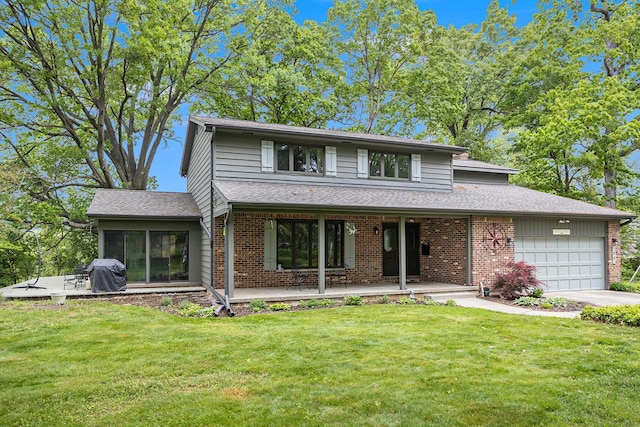 44 Bayshore Dr, Battle Creek, MI 49015 - view of front of home with an attached garage, a front lawn, brick siding, and covered porch