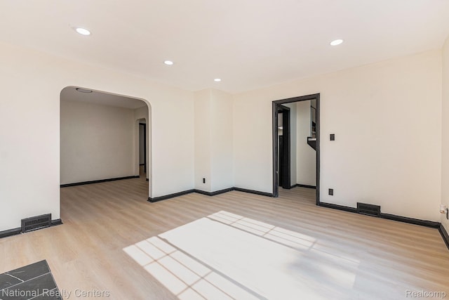 18691 Greenlawn St, Detroit, MI 48221 - spare room featuring arched walkways, light wood finished floors, recessed lighting, and baseboards