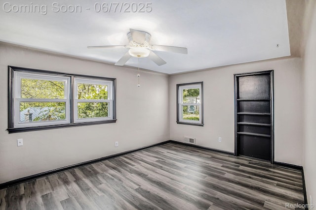 11393 Outer Dr, Pinckney, MI 48169 - unfurnished room with wood finished floors, baseboards, and ceiling fan