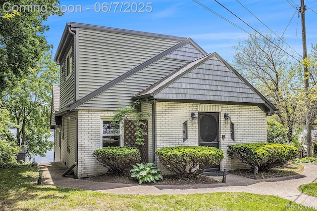 11393 Outer Dr, Pinckney, MI 48169 - view of property exterior with brick siding