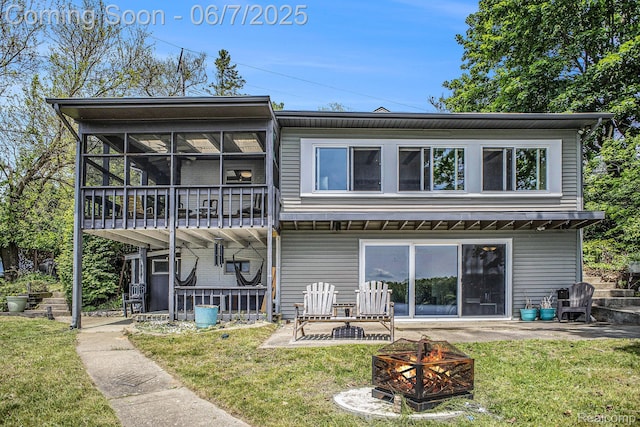 11393 Outer Dr, Pinckney, MI 48169 - rear view of house with a fire pit and a yard