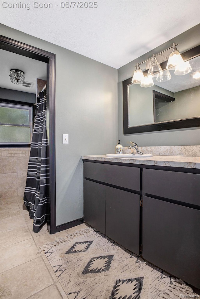 11393 Outer Dr, Pinckney, MI 48169 - bathroom featuring vanity, baseboards, and tile patterned flooring