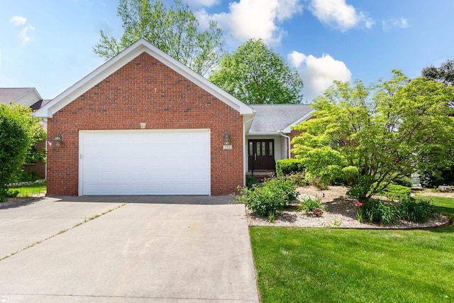 353 Golfside Dr, Lapeer, MI 48446 - view of front of house with brick siding, a front yard, concrete driveway, and a garage