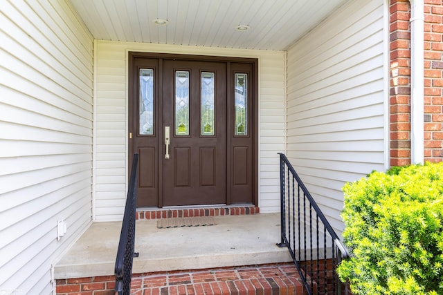 353 Golfside Dr, Lapeer, MI 48446 - doorway to property featuring brick siding