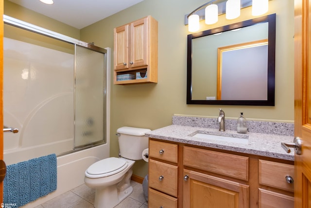 353 Golfside Dr, Lapeer, MI 48446 - bathroom with vanity, toilet, tile patterned floors, and combined bath / shower with glass door
