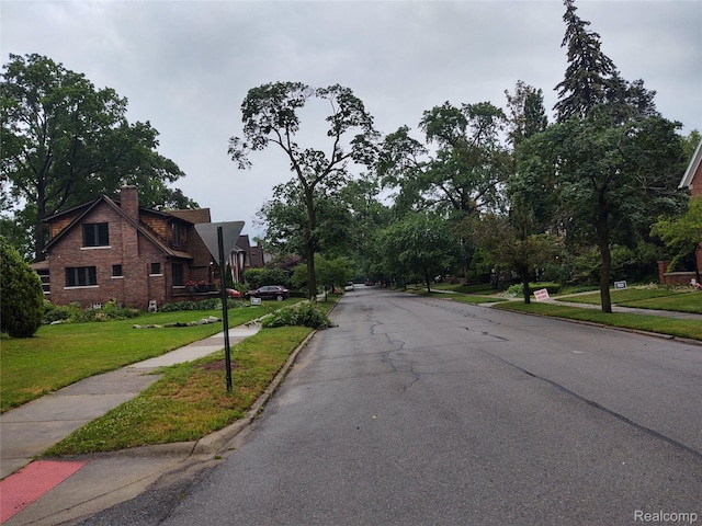 20066 Briarcliff Rd, Detroit, MI 48221 - view of asphalt street featuring sidewalks and curbs