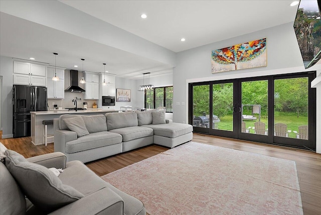 8011 Date Rd, Stevensville, MI 49127 - living area with recessed lighting, light wood finished floors, and a chandelier